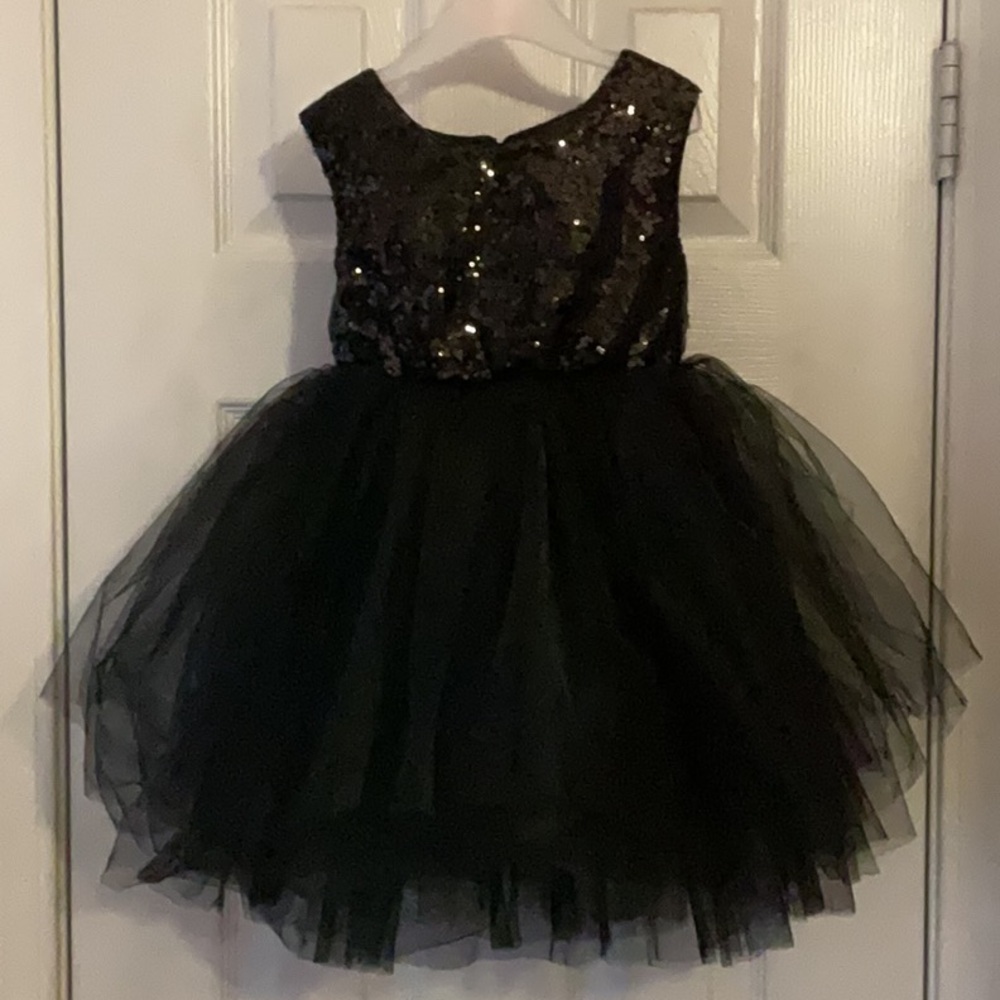 Adorable black sequence too and taffeta bottom dress.
